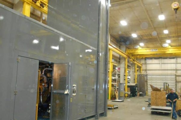Rooftop enclosures housing a generator and compressor
